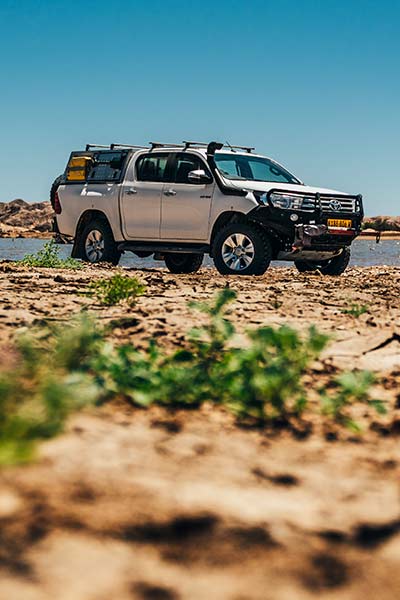 Asco off-road 4x4 Rental Vehicle featuring rooftop tent and bull bar