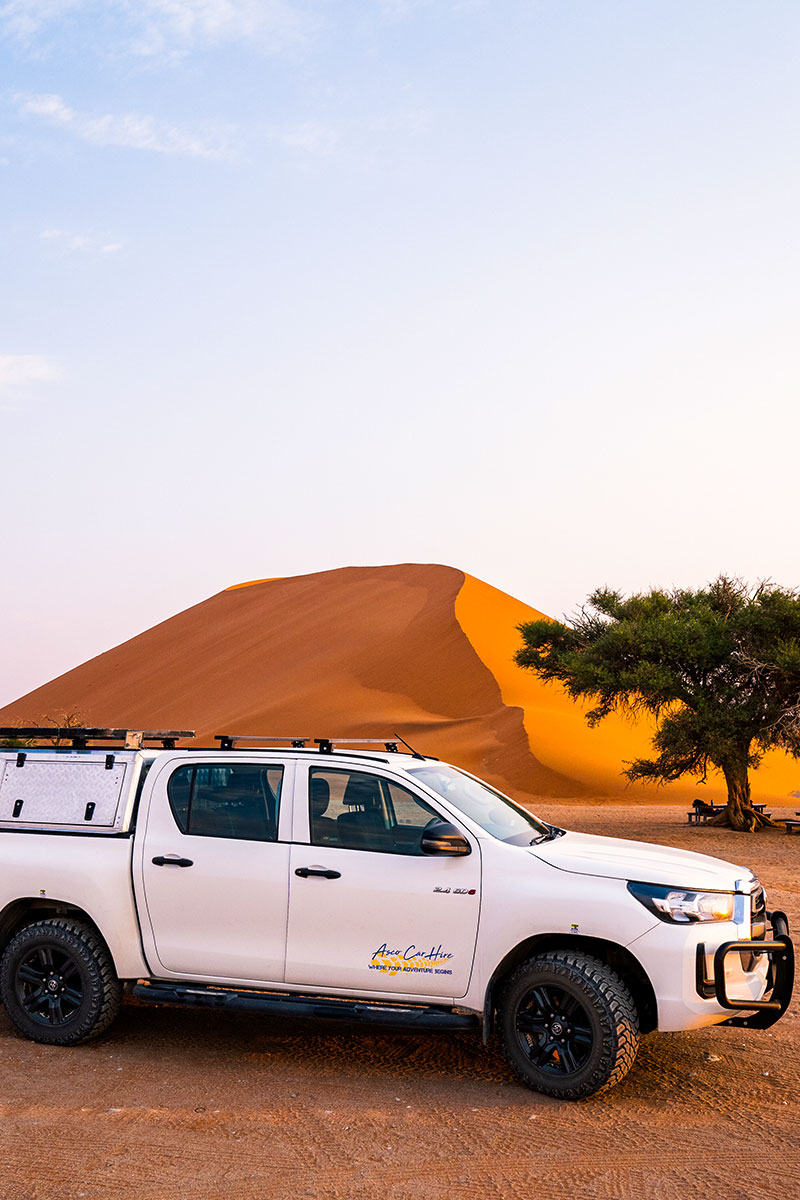 Standard Asco Car Hire parked near sand dune Namib-Naukluft National Park Sossusvlei
